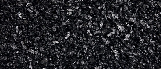Fuel for furnace heating - hard coal. Pile of natural black hard coal for texture background. Best...