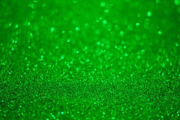 Green glitter background...Texture of the green glitter particles.