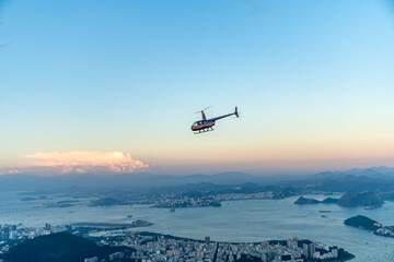 helicopter over the brazilian city of rio de janeiro. tourist attraction