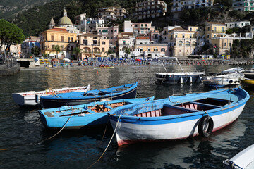 Fototapeta na wymiar Fishing boats in front of the village of Cetara, Italy