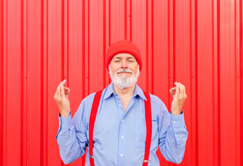 Zen, meditation, balance and peace concept. Elderly hipster holding his fingers in mudra gesture,...