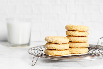 Fototapeta na wymiar cookies stacked with milk on white background 