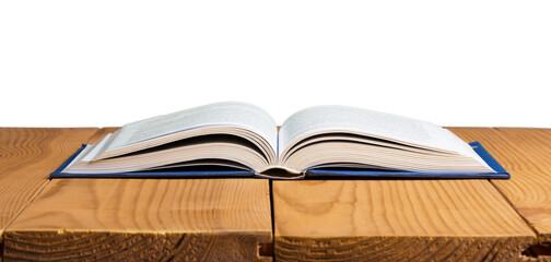 An open book lies on a wooden table