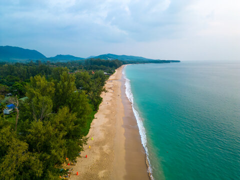 Aerial drone view of tropical beach at Ko Lanta island, Thailand. Coastline view of famous target destination. Pure turquoise water and white sand.