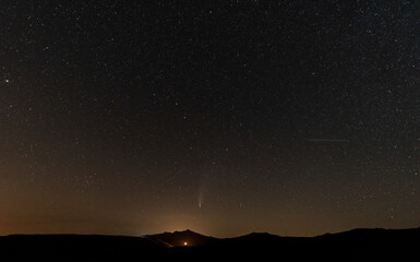 Neowise comet over the mountain pyramid peak, wide angle