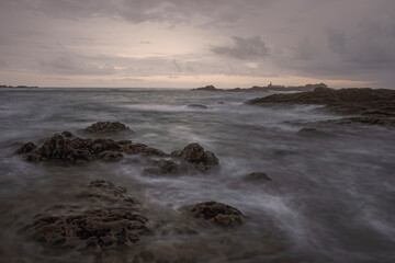 Rocky beach at sunset or dusk