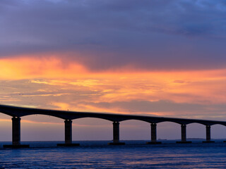 Sunset over the Herbert C Bonner new bridge spanning the Oregon Inlet on the Outer Banks of North...