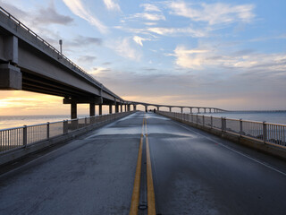 The old Bonner Bridge over the Oregon Inlet now converted to a pedestrian and Fishing pier next to the new Herbert C Bonner bridge construction