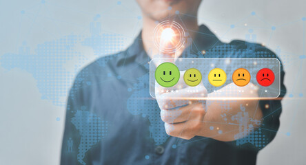 customer services satisfaction,Businessman pressing smiley face emoticon on virtual touch screen.Customer service experience evaluation concept.