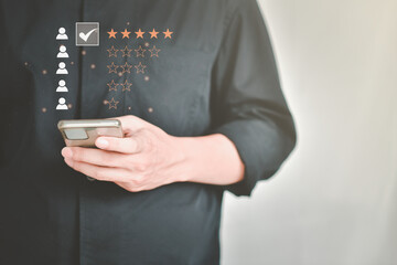 Customer service and Satisfaction concept ,give rating to service experience on online application on the happy Smiley face icon to give satisfaction in service. rating very impressed