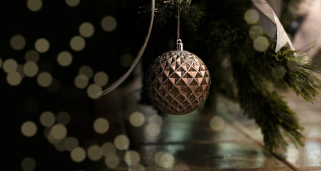 detail of hanging christmas tree ornaments.  Christmas background.  blurred lights with Bokeh effect. Merry christmas and happy new year concept.