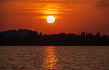 The sun goes down over a lake