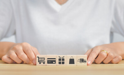 Shopping online concept.wooden cube stack,doing online banking transaction. E commerce icon, secure mobile banking concept,Shopping Online Using Mobile Phone App