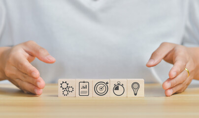 business strategy, Action plan, Goal and target, hand stack woods block step on table with icon about business strategy and Action plan. business development concept. copy space