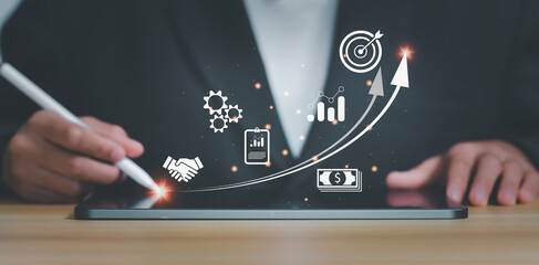 Startup concept,business touching on tablet with icon business and network connection on modern virtual interface from digital tablet