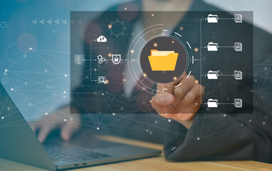 Document Management System (DMS), online documentation database and process automation to efficiently manage files, knowledge and documentation in enterprise with ERP. IT consultant working on laptop