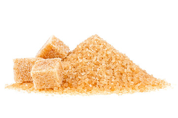 Crystals of cane sugar and brown sugar cubes isolated on a white background. Brown caramel cane...