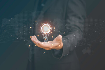 A light bulb on the hand And there is a gear icon in it.The idea of ​​inspiration from online technology. innovation idea concept.Smart thinking idea and inspiration innovation concept