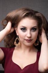 Fototapeta premium Attractive brunete young woman shows healthy hair, close up