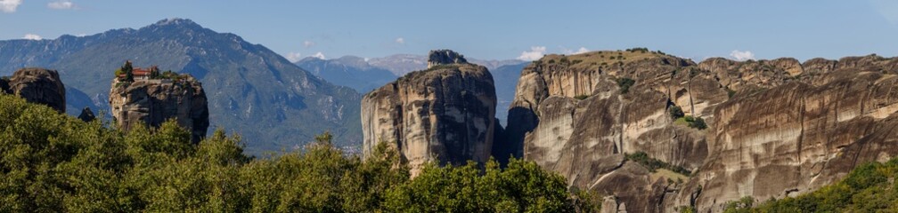 Mountain panorama with the Monastery of the Holy Trinity. Meteora Kalambaka Greece. Travel, hiking, vacation. Famous Greek orthodox christian shrine, unique rock formation, Unesco world heritage site.