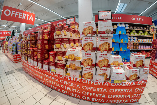 Bra, Cuneo, Italy - November 30, 2022: packs of Balocco e Maina brand panettone displayed in the offer pallet and shelves in an Italian supermarket. Tex: Offerta (offer)
