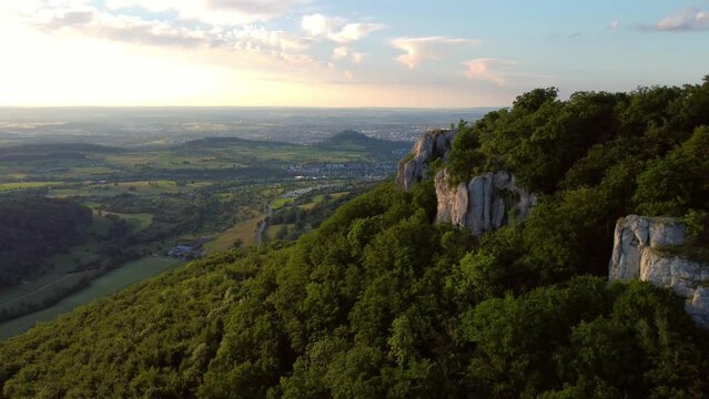 Aerial footage of reverse flight alongside scenic cliffs in the Swabian Jura in Southern Germany