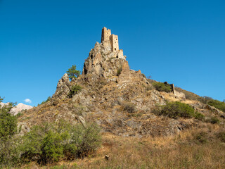Fototapeta na wymiar Hard-to-reach ancient battle towers on the rocks. Unique medieval tower complex Vovnushki, one of the authentic medieval castle-type tower villages, located in Ingushetia.