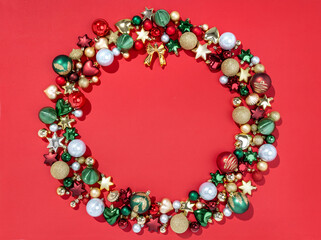 Silhouette of Christmas wreath made of fir tree toys on red background. Merry Christmas and Happy New Year concept