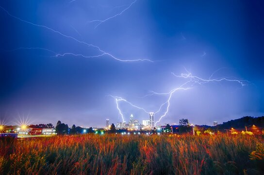 Lightning thunderbolts over charlotte skyline