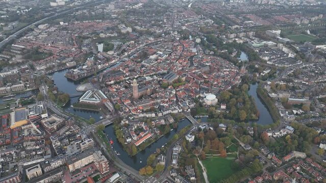 Zwolle old historic city center and city walls overhead skyline. Canal around city with rich history, Pepperbus church tower, Sassenpoort, Onze Lieve Vrouwebasiliek aerial.