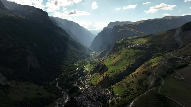 French alps valley aerial view summer la grave village sunny beautiful light green grazing