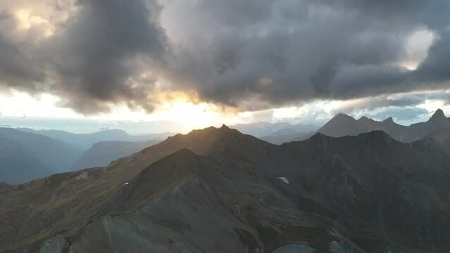 Sunset over mountains ridges french alps aerial view