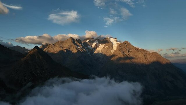 Over clouds sunrise view of a mountain ecrins national park France