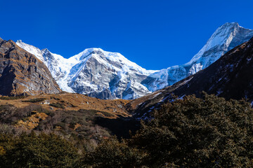 Fototapeta na wymiar Beautiful Snowy Mountains Trekking in Mt. Api Base Camp in Himalayas, Darchula, Nepal