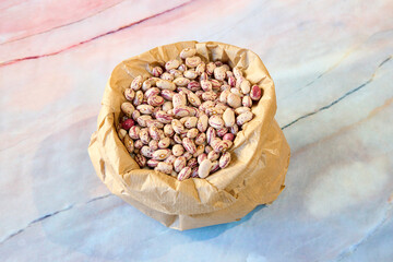 bag full of black beans on a marble table