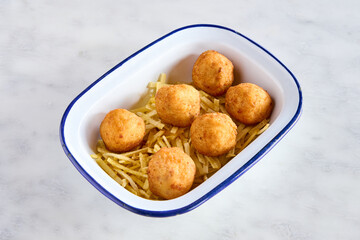 plate with ham croquettes and chips