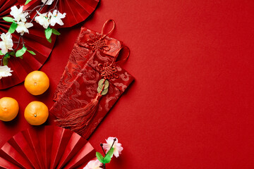 Happy Chinese New Year 2023 banner design. Flat lay oranges, money envelopes, festival paper fans...