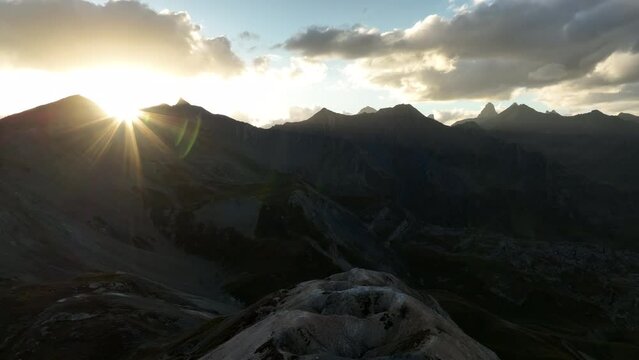 Discovering the sun setting over french alps mountains aerial beautiful large shot national park