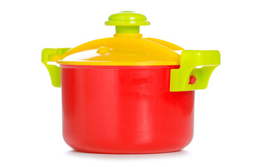 Children's toy plastic saucepan on white background isolation
