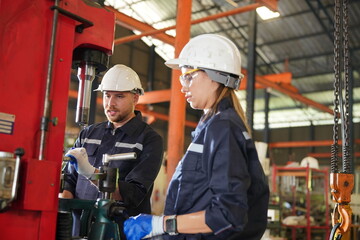 Female empowerment, working female industry technical worker or engineer woman working in an industrial manufacturing factory.