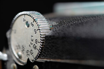 Close up of vintage camera focus dial
