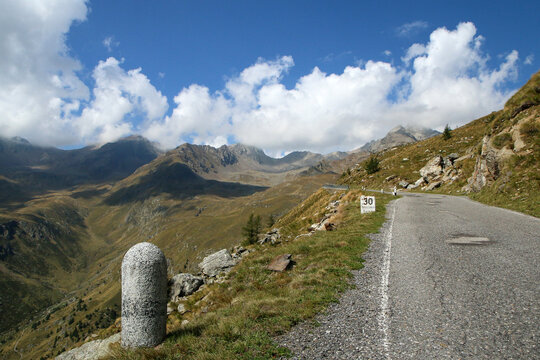 The view of the road climbing to the Passo di Gavia in Italy. The narrow and challenging road towards the summit. 