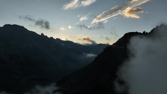 sunrise in the mountains silhouette  shape aerial shot massif des ecrins