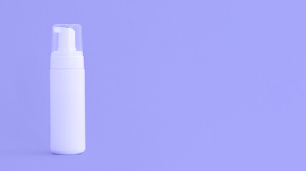 Cosmetics, Moisturizer, Bottle. Blank plastic cosmetics bottle on background with copy space. Tinted image