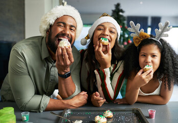 Christmas, family and cookie eating of a mother, father and girl in a home kitchen with happiness....