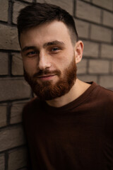 Obraz premium Young handsome man with a red beard, portrait, close-up.