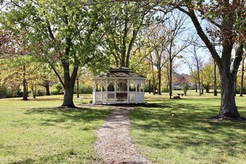 The white gazebo in the countryside on a sunny day.