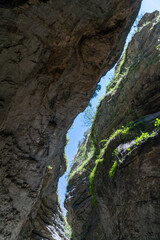 Beautiful curved crevice in canyon in sunny weather. Wide angle view of amazing sandstone formations in Salta gorge in mountains of Dagestan, Russia.