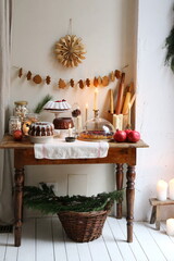 Table with Christmas sweet treats, cupcake, pie and stolen