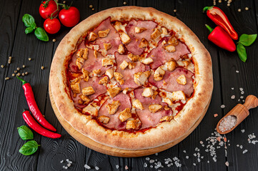 Tasty and big pizza with different types of meat